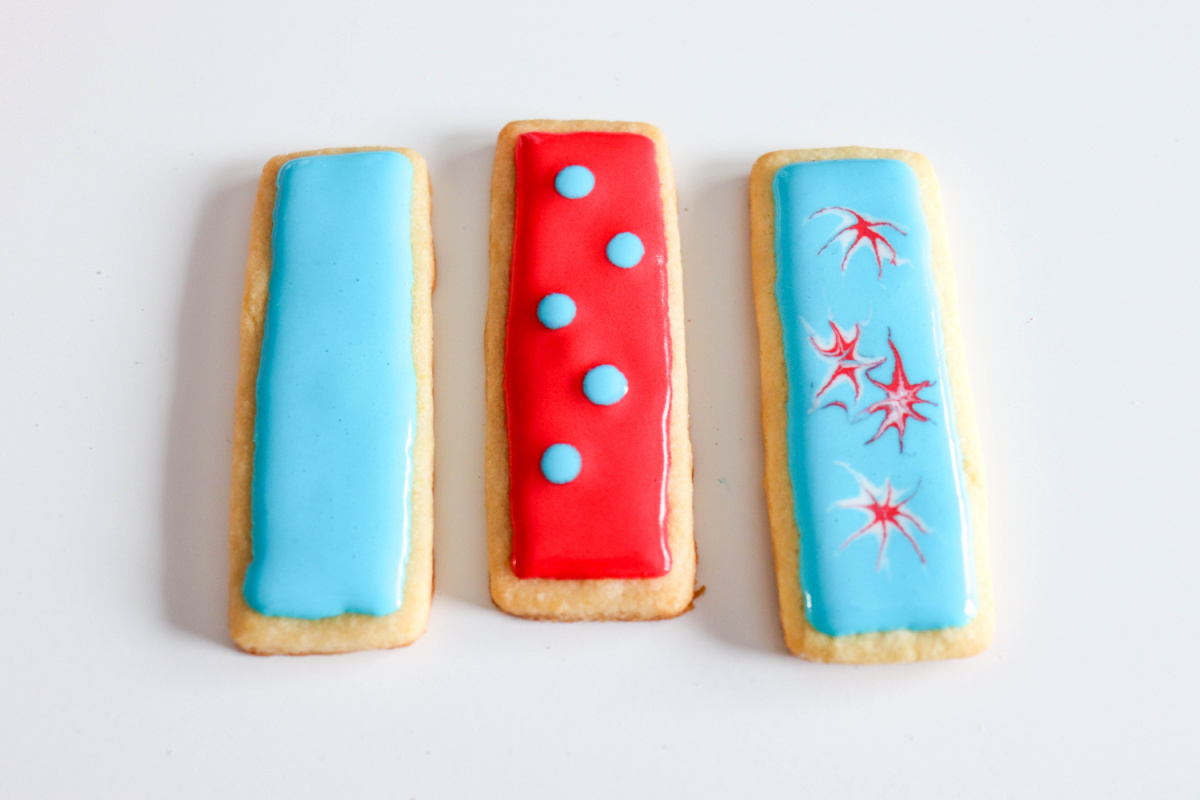 placing dots on sugar cookies