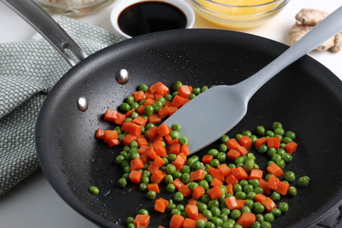 peas and carrots in a pan