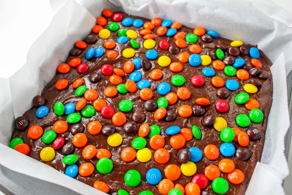 M&M candies added to top of brownies