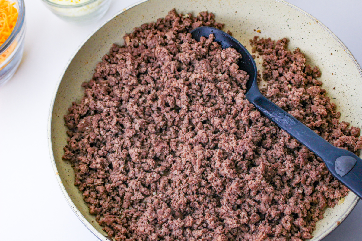 ground beef cooking in pan