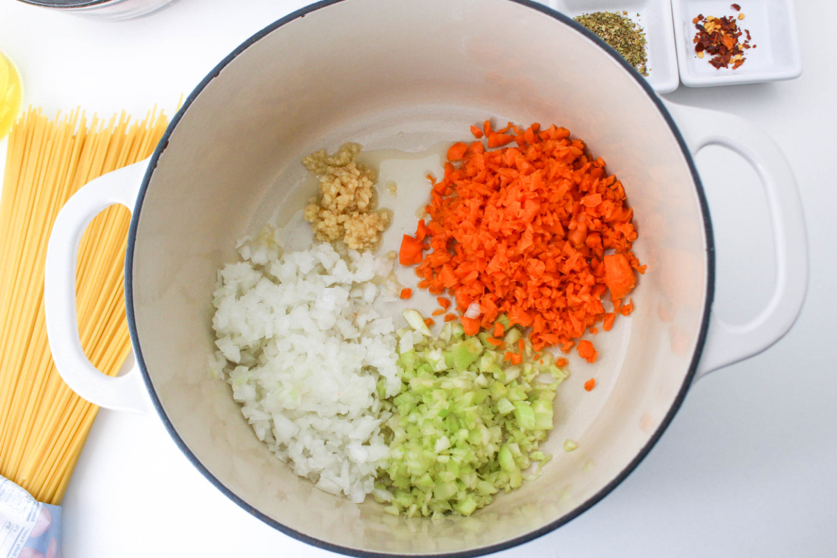 chopped onion, garlic, carrots and celery in a pot