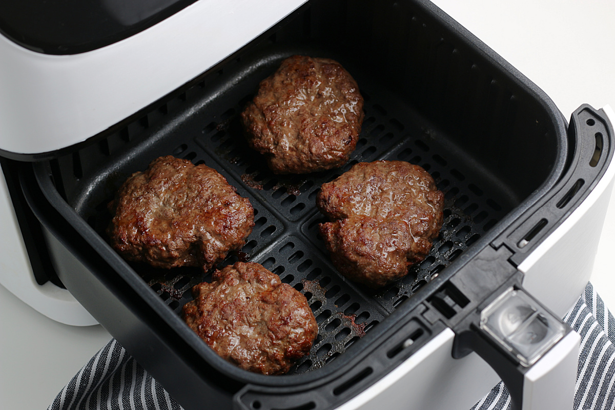 cooked burgers in air fryer basket