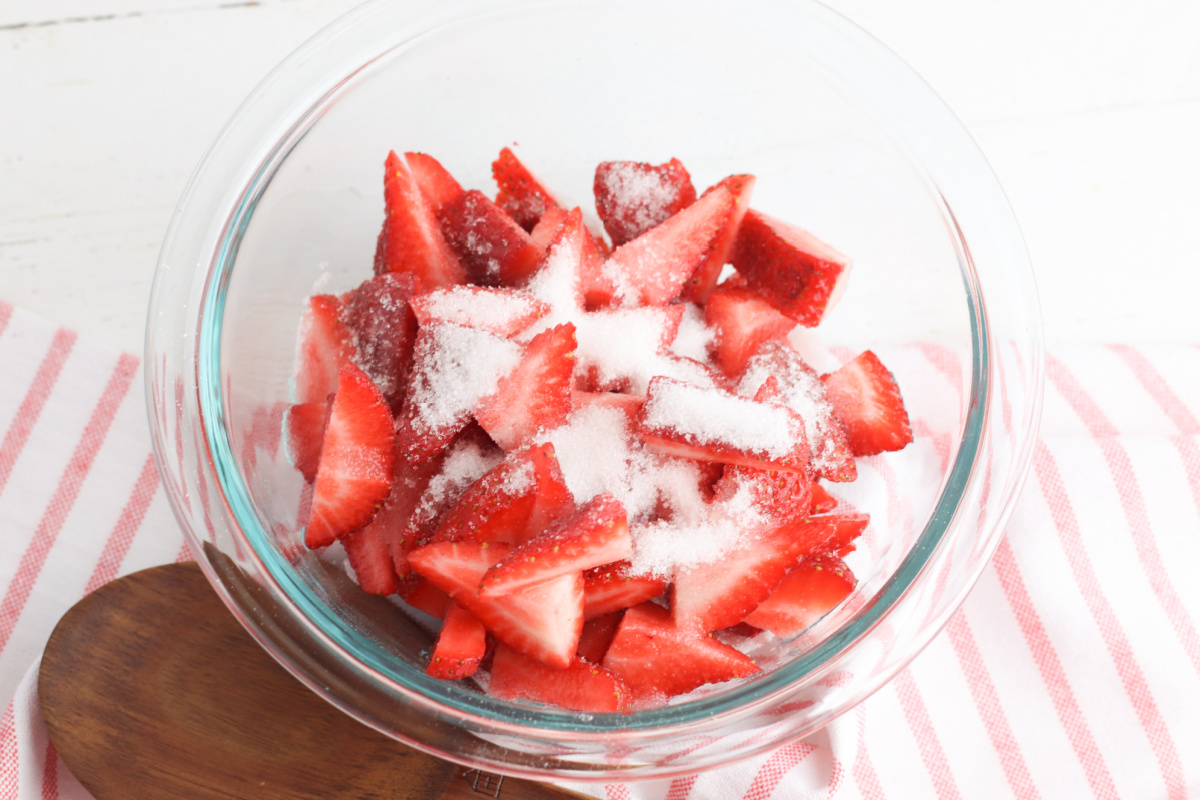 strawberries and sugar in a bowl