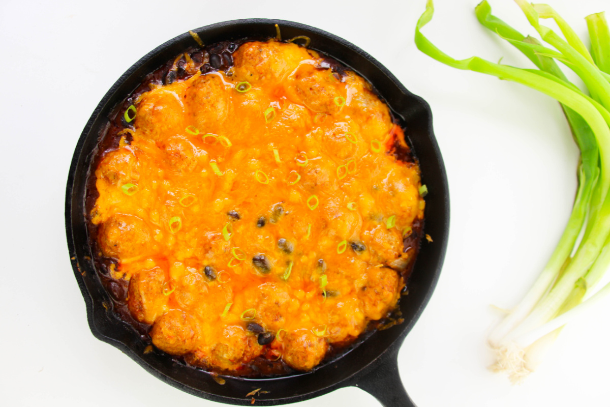 baked enchilada meatball bake in a pan