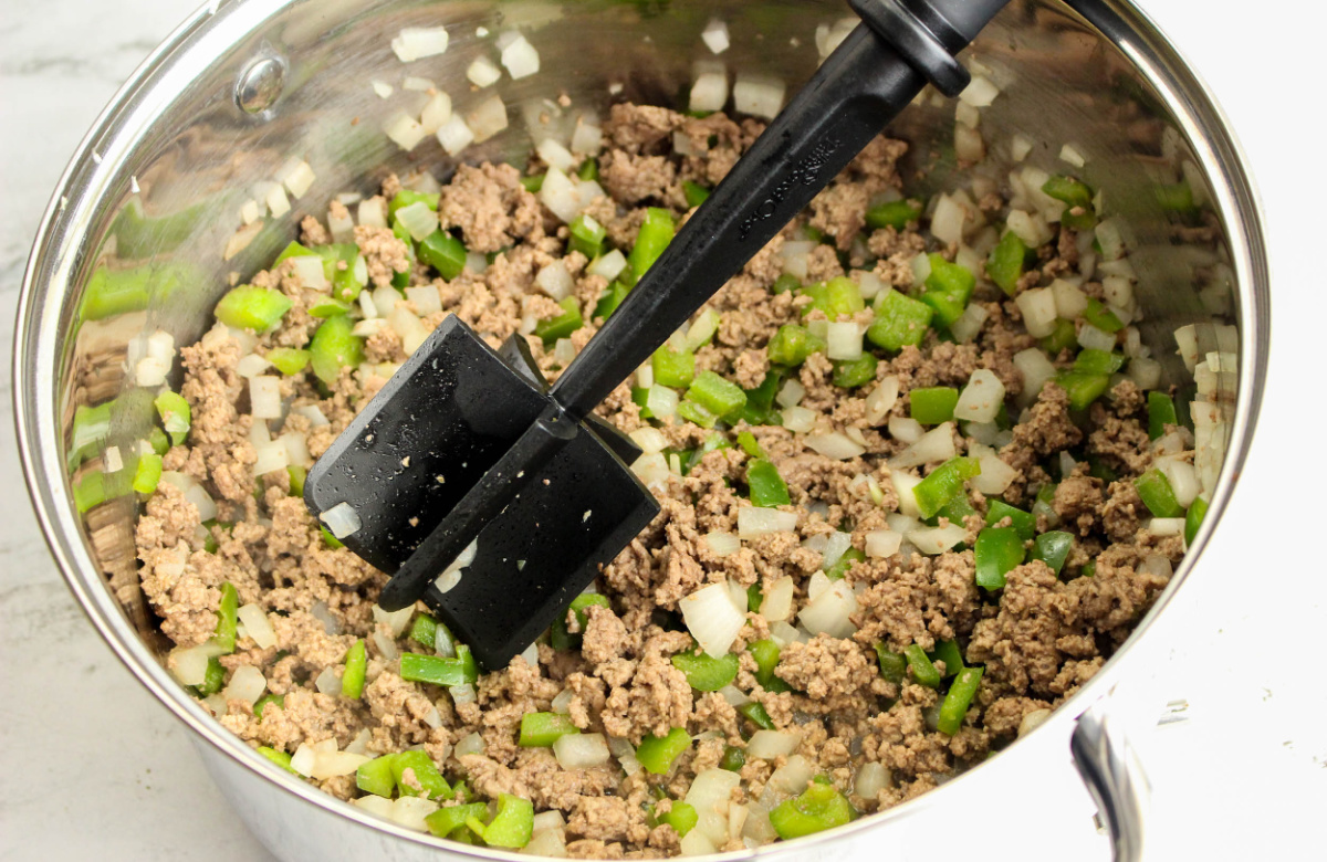 browning ground beef and veg in a pot