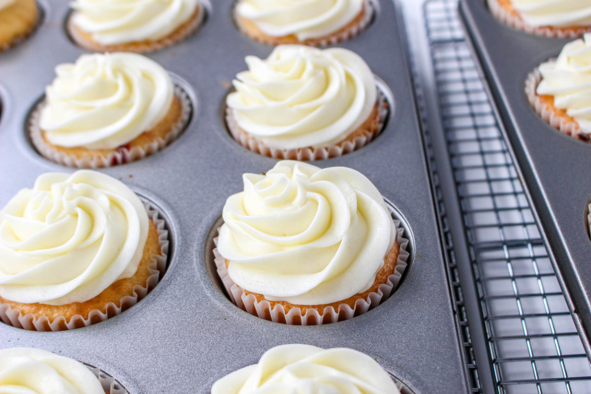 frosted cupcakes in a muffin tin