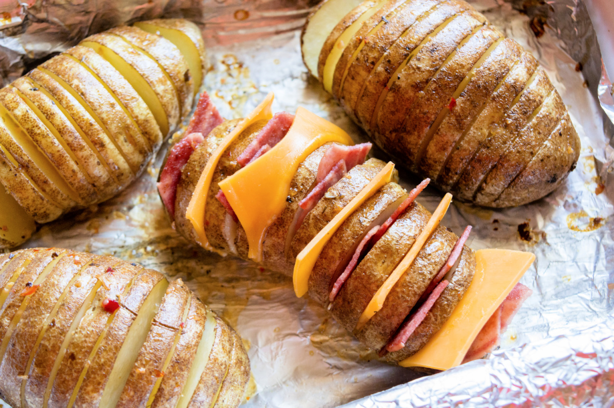 cheese and bacon placed into potato slices