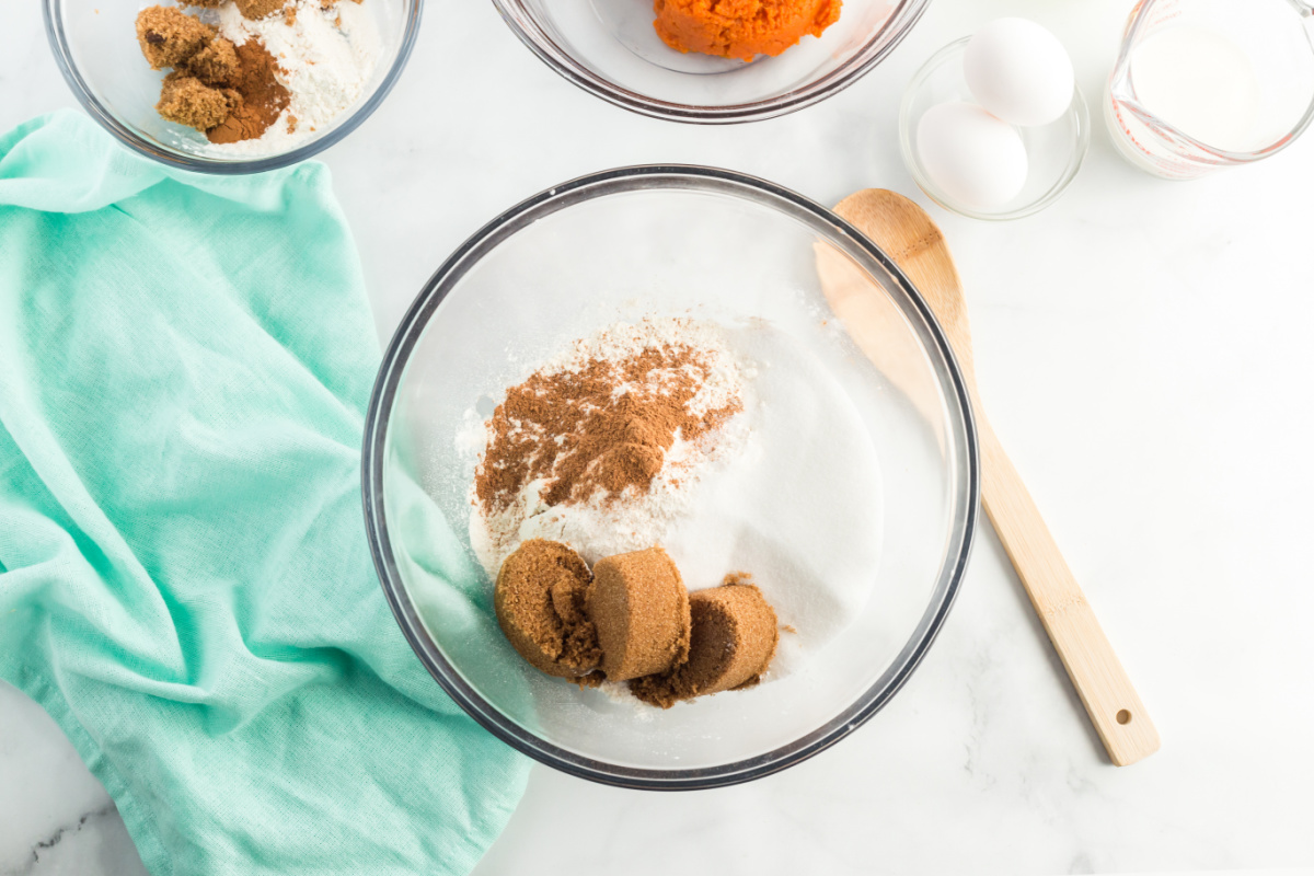 flour, sugars, baking powder, pumpkin pie spice and salt in a bowl