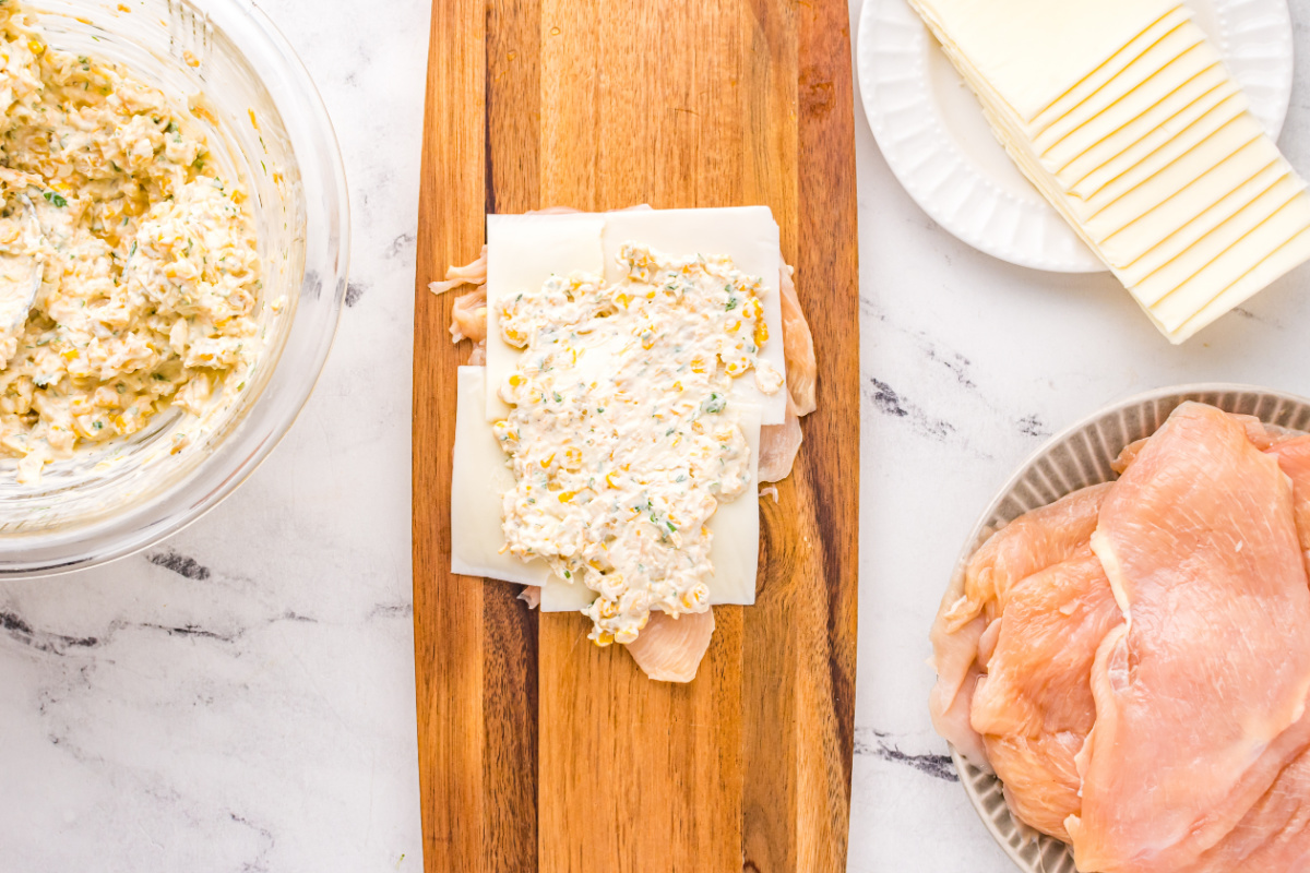 cream spread placed on top of cheese slices