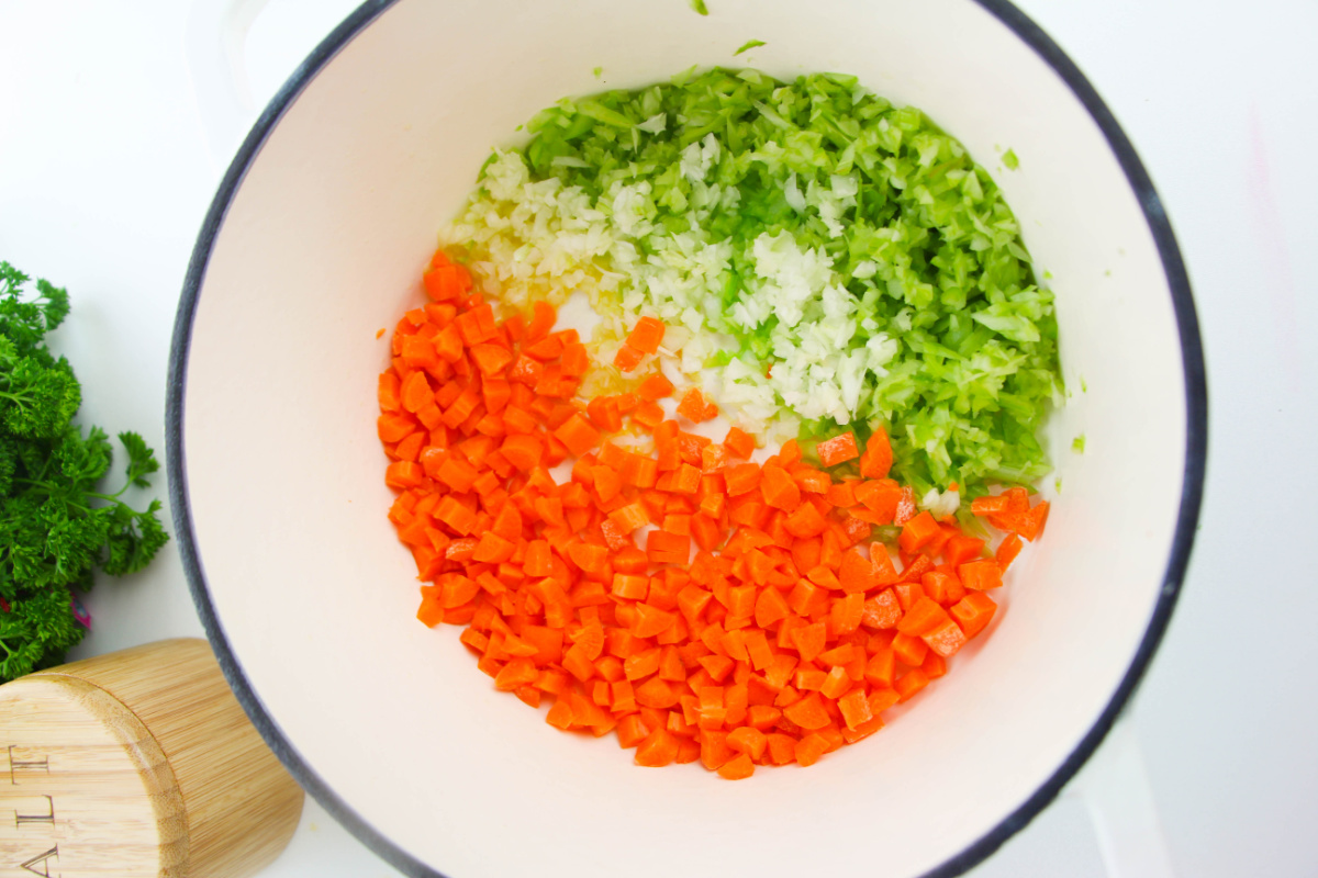 carrots, onion and celery in a soup pot