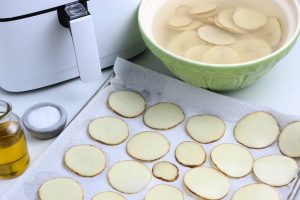 potato slices drying on paper towel