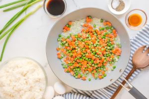 peas and carrots added to pan