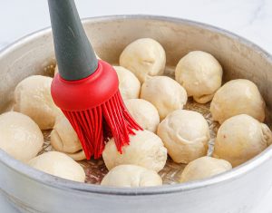brushing the top of meatball bites
