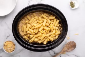 cooked pasta added to slow cooker
