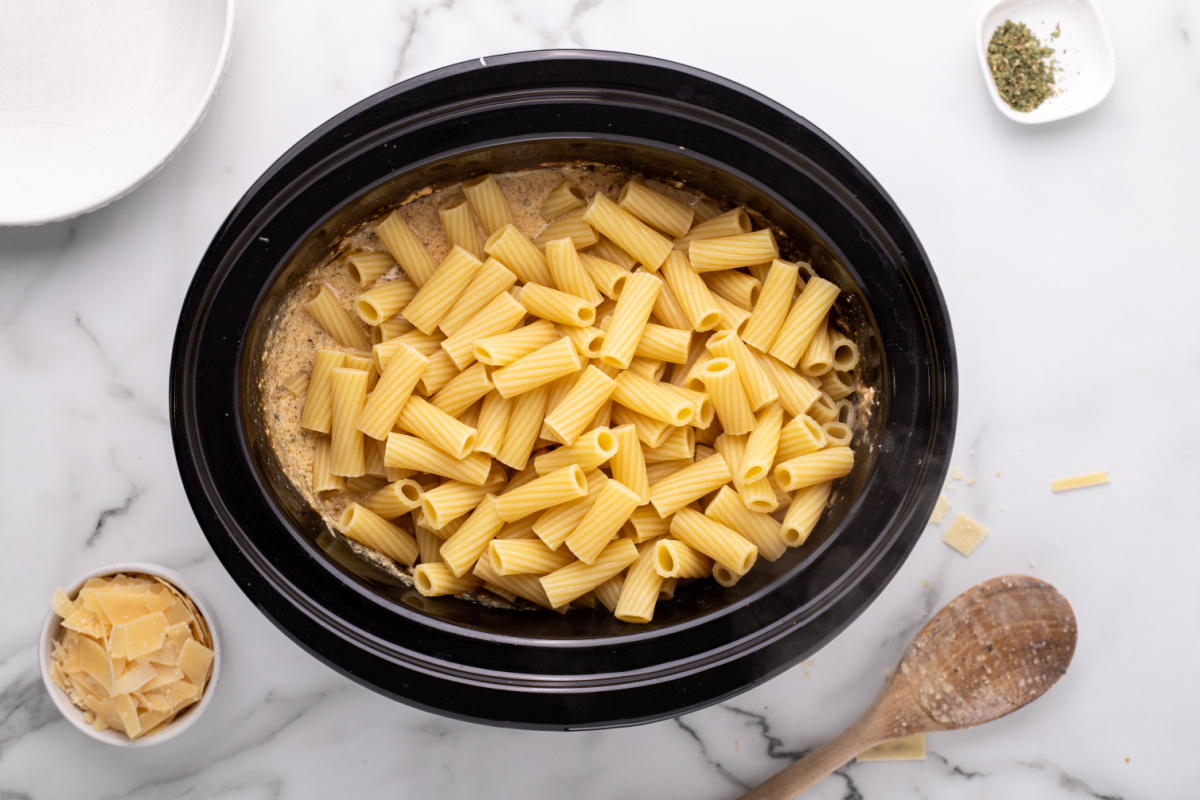 cooked pasta added to slow cooker