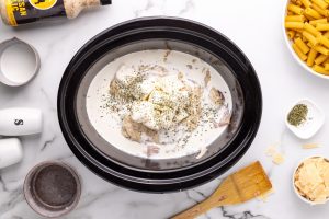 parmesan garlic sauce, cream cheese, heavy cream, and milk added to top of chicken