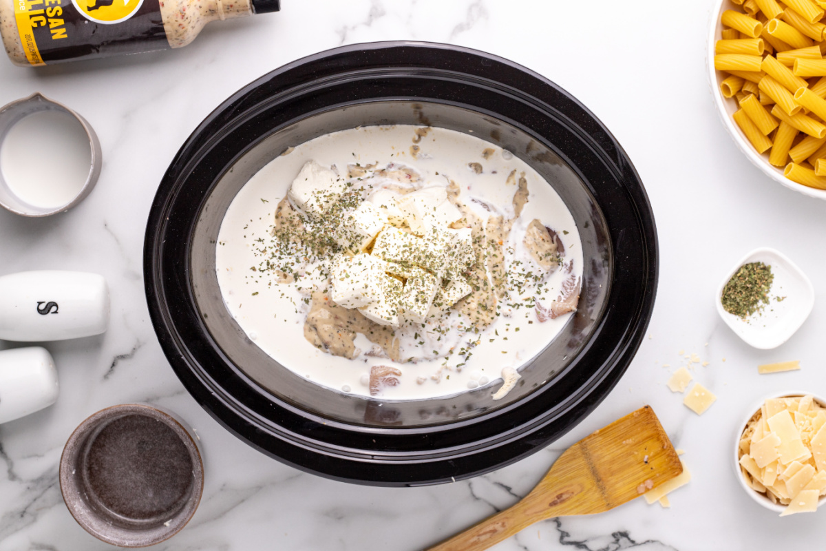parmesan garlic sauce, cream cheese, heavy cream, and milk added to top of chicken