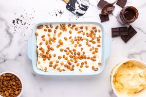 peanuts added to top of ice cream