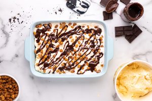 fudge drizzled over peanuts