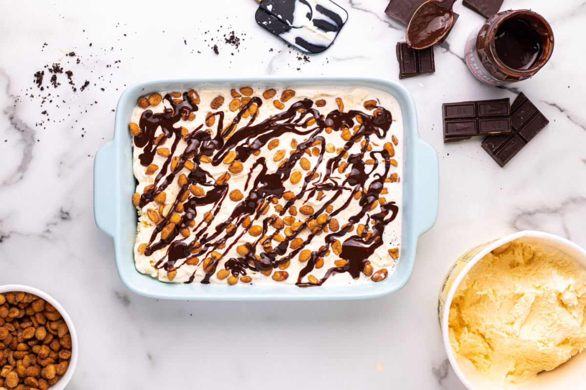 fudge drizzled over peanuts