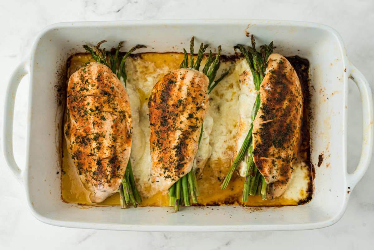 Creamy Asparagus Stuffed Chicken Breasts in a baking dish