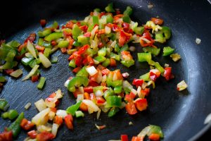 peppers and onions in a pan