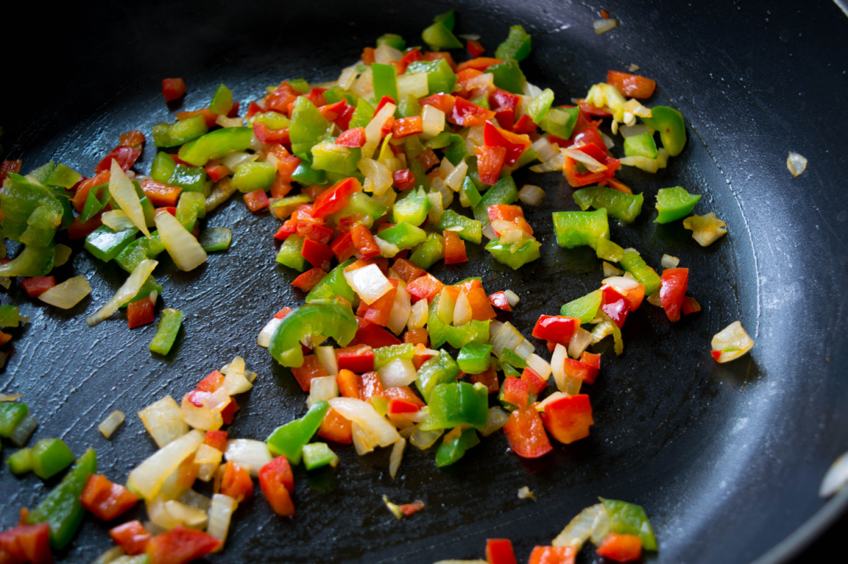peppers and onions in a pan