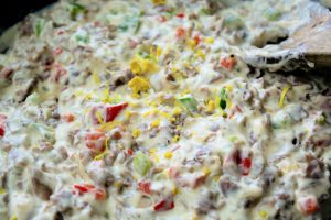 roast beef, cheeses, and milk added to the pan