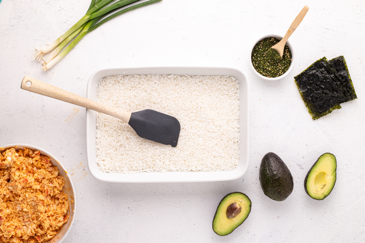 rice spread into baking dish