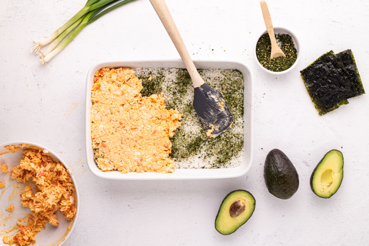 crab mixture spread of top of rice