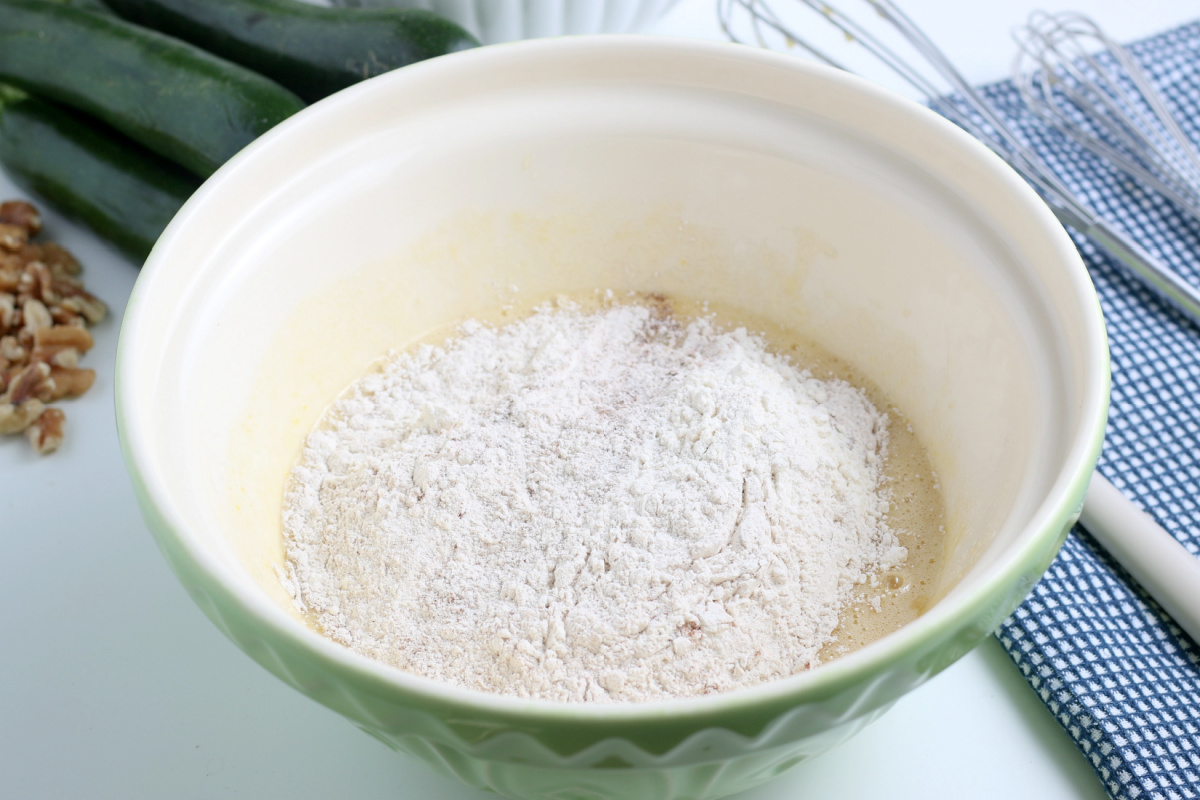 adding dry ingredients into bowl