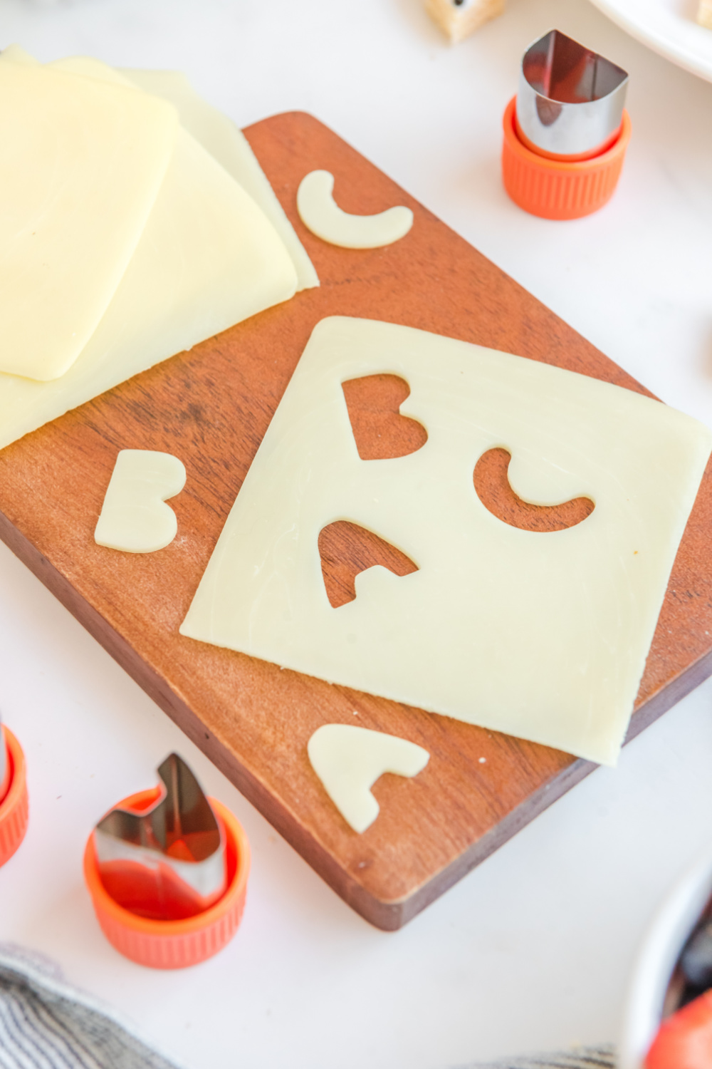 cutting letters out of cheese