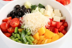 Classic Italian Pasta Salad ingredients in a bowl
