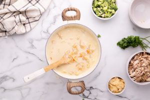stirring in pasta