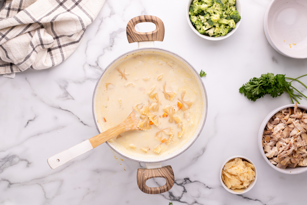 stirring in pasta