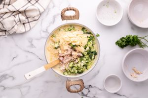 chicken, broccoli, and parmesan cheese added to pot