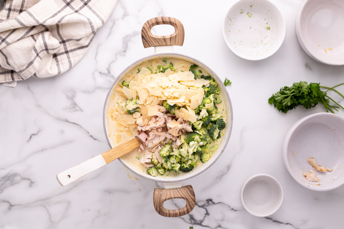 chicken, broccoli, and parmesan cheese added to pot