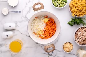 butter, carrots, onions, and garlic in a pot