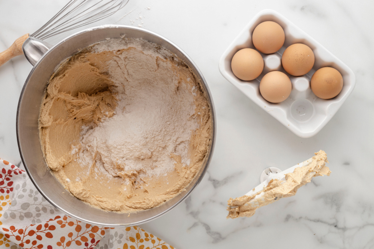 adding flour into cookie batter