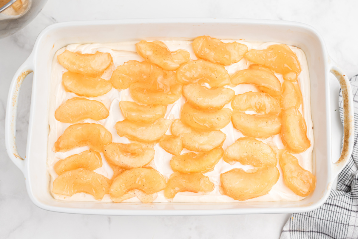 apple pie filling placed on top of whipped cream layer