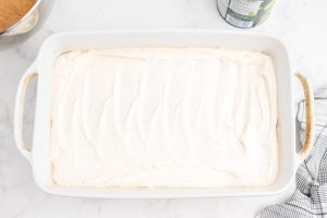 whip cream topping spread on top of cookie frust