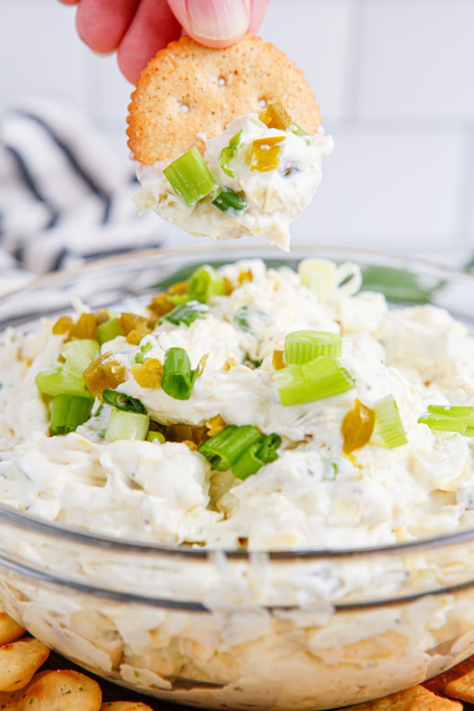 Artichoke Jalapeno Dip in a bowl with crackers
