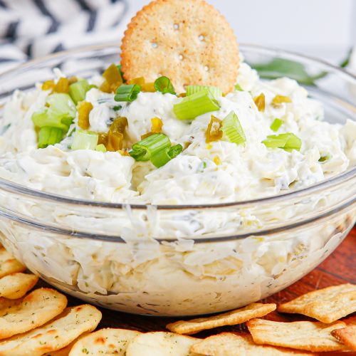 Artichoke Jalapeno Dip in a bowl with crackers