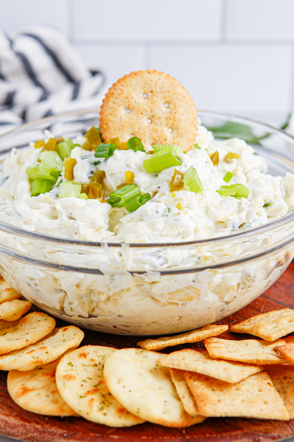 Artichoke Jalapeno Dip in a bowl with crackers