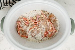 creamy mixture added to top of chicken