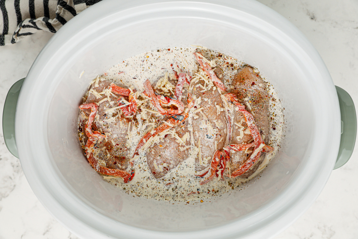 creamy mixture added to top of chicken