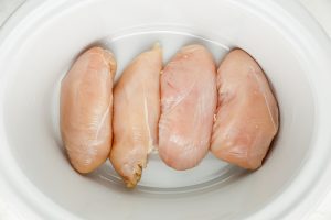 chicken placed in slow cooker