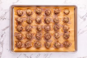 cooked meatballs on a baking sheet