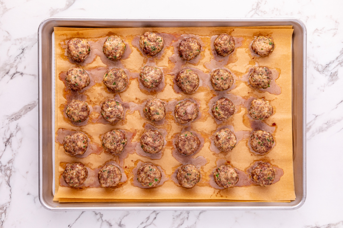 cooked meatballs on a baking sheet
