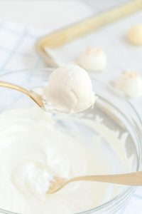 White Chocolate Champagne Truffles being dipped in chocolate